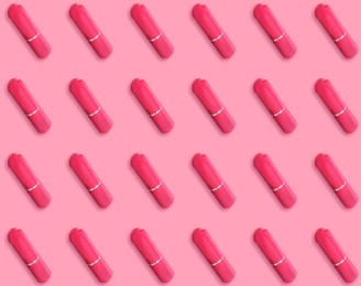 Many tampons on pink background, flat lay 