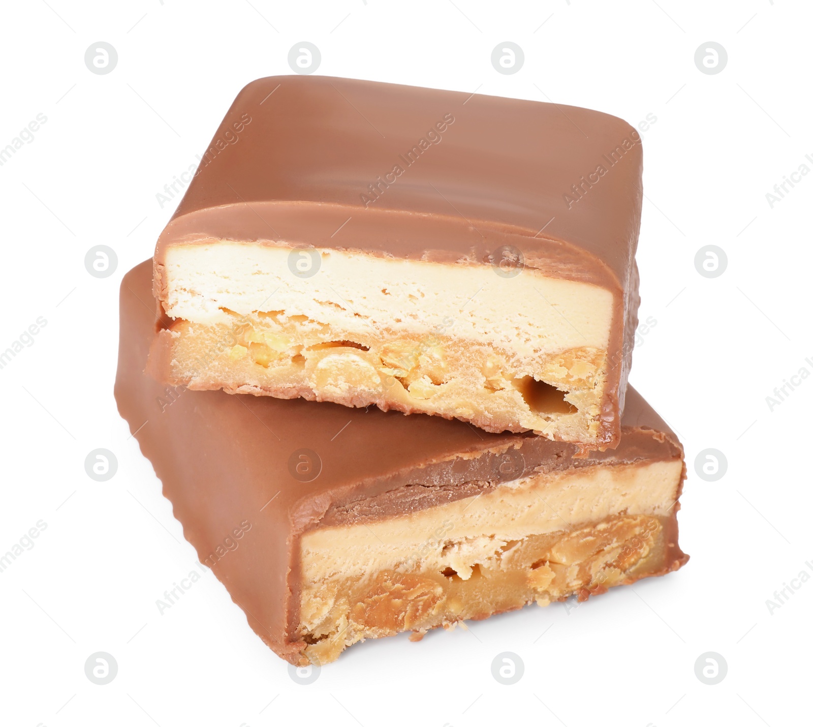 Photo of Pieces of tasty chocolate bars with nougat and nuts on white background