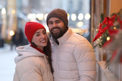 Lovely couple spending time together on city street