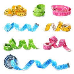 Set with different measuring tapes on white background