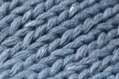 Photo of Light blue knitted fabric as background, macro