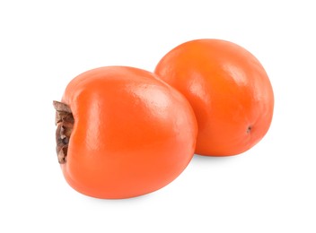 Photo of Delicious ripe juicy persimmons isolated on white