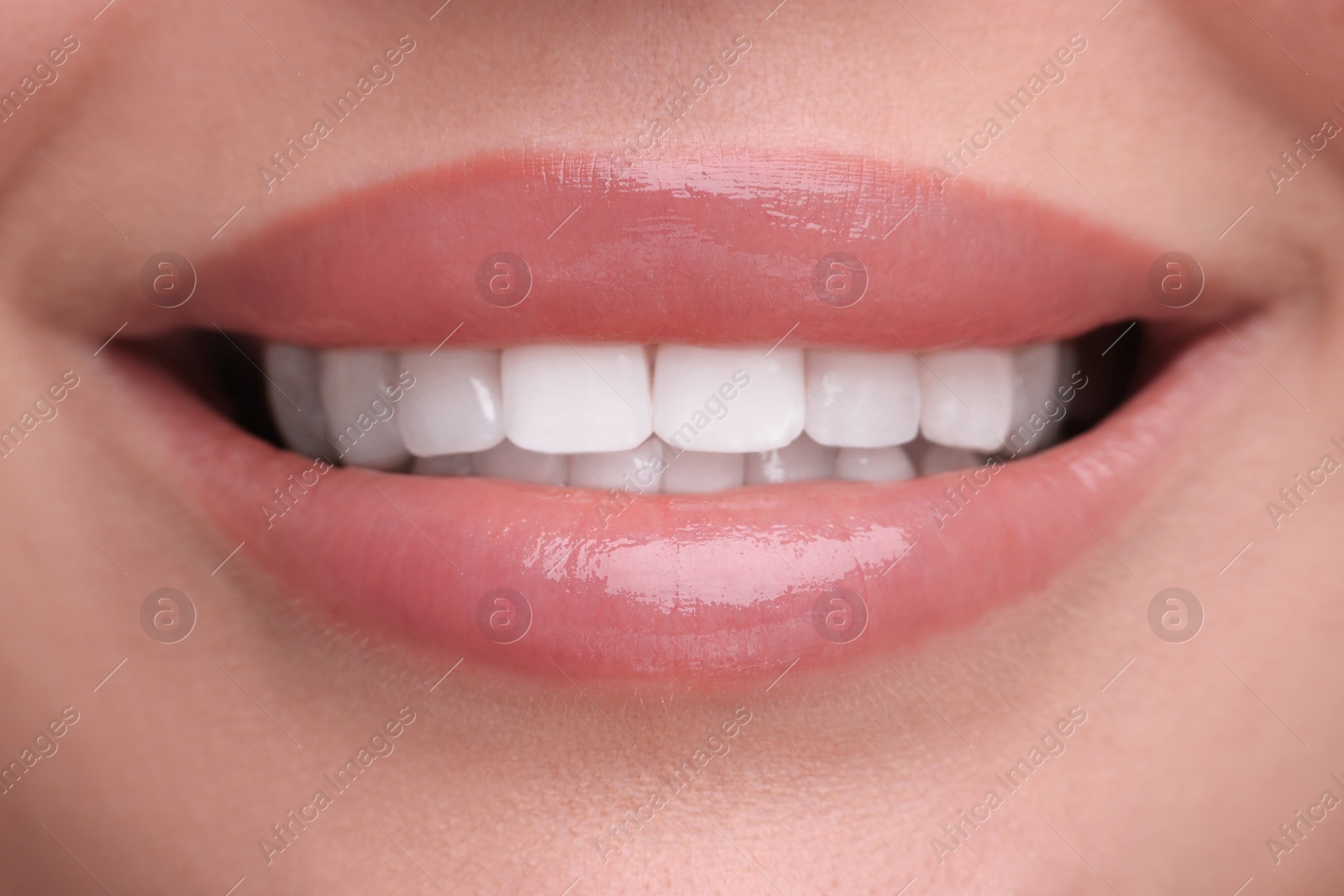 Photo of Woman with beautiful lips smiling, closeup view