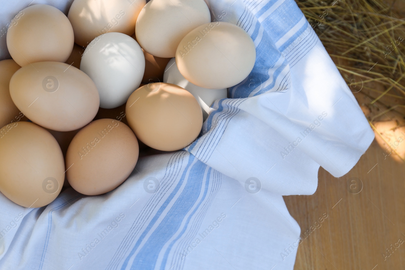 Photo of Fresh raw eggs on table, top view