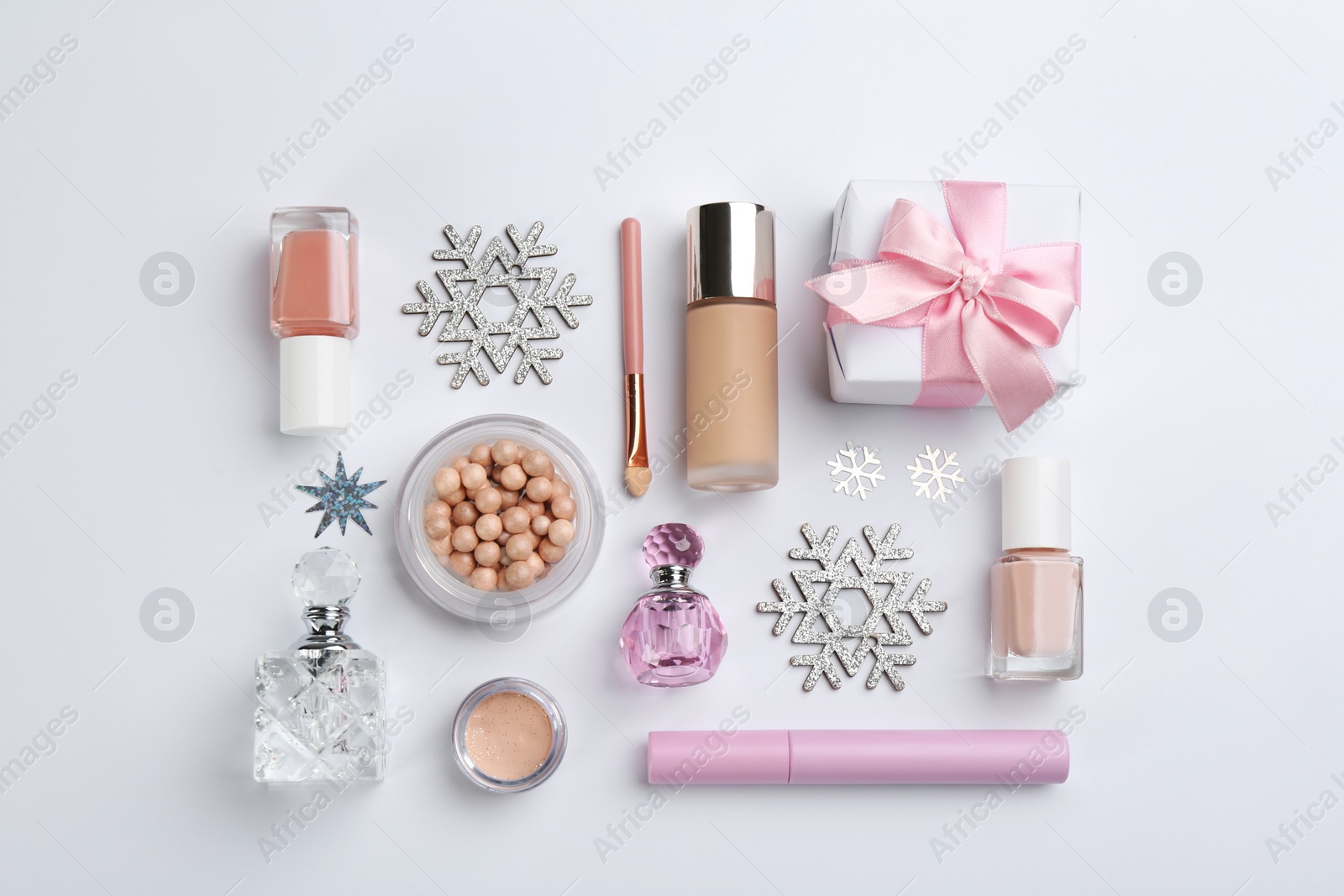 Photo of Flat lay composition with decorative cosmetic products on light background. Winter care