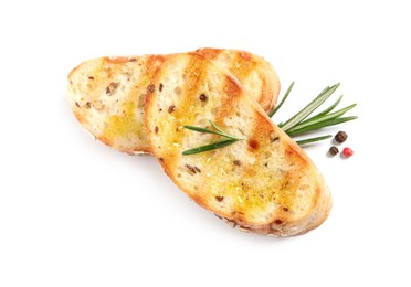 Photo of Tasty bruschettas with oil, rosemary and pepper on white background, top view