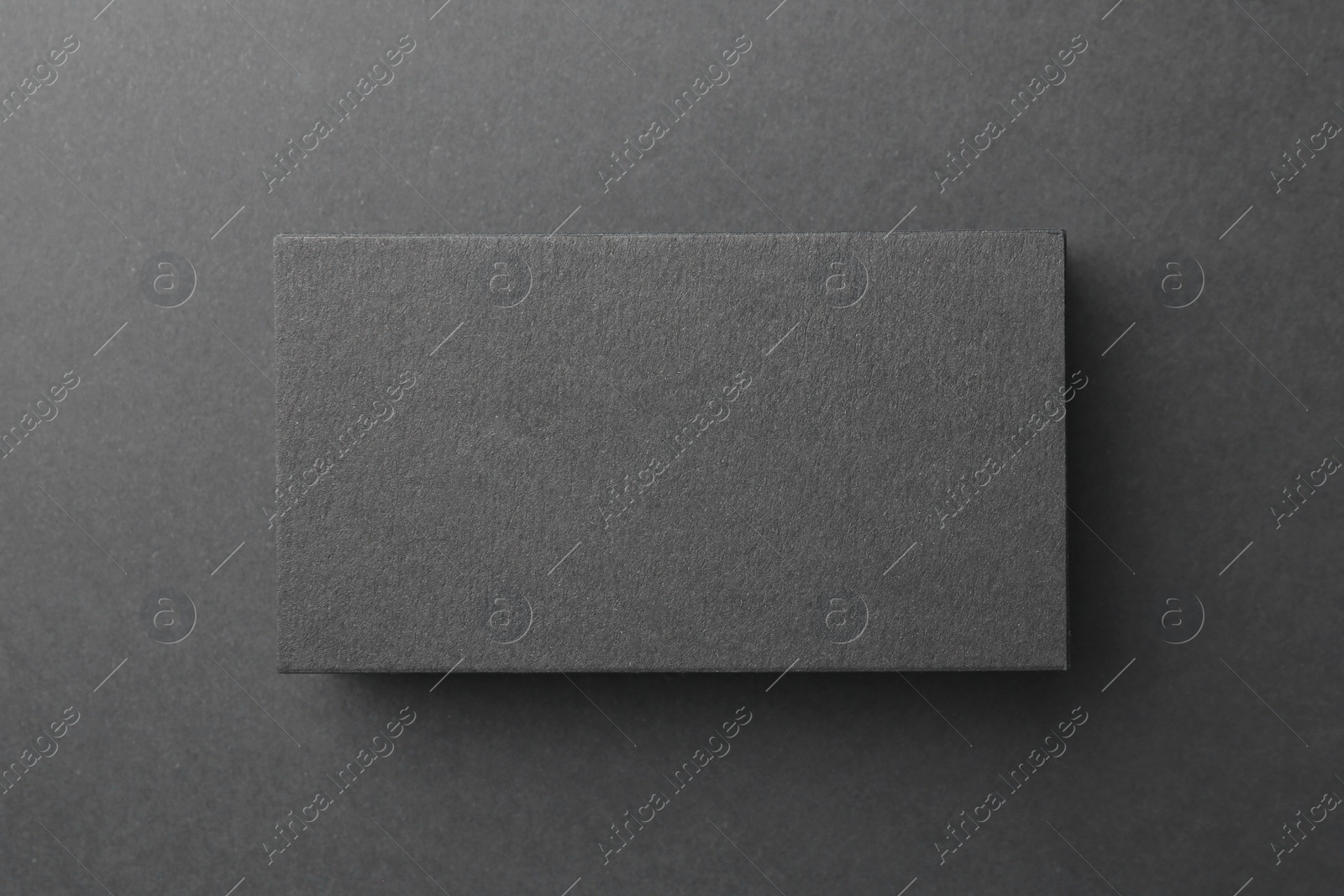 Photo of Blank business card on black background, top view. Mockup for design