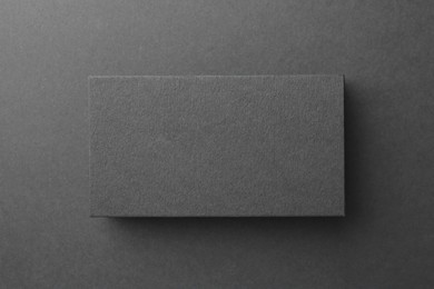 Photo of Blank business card on black background, top view. Mockup for design