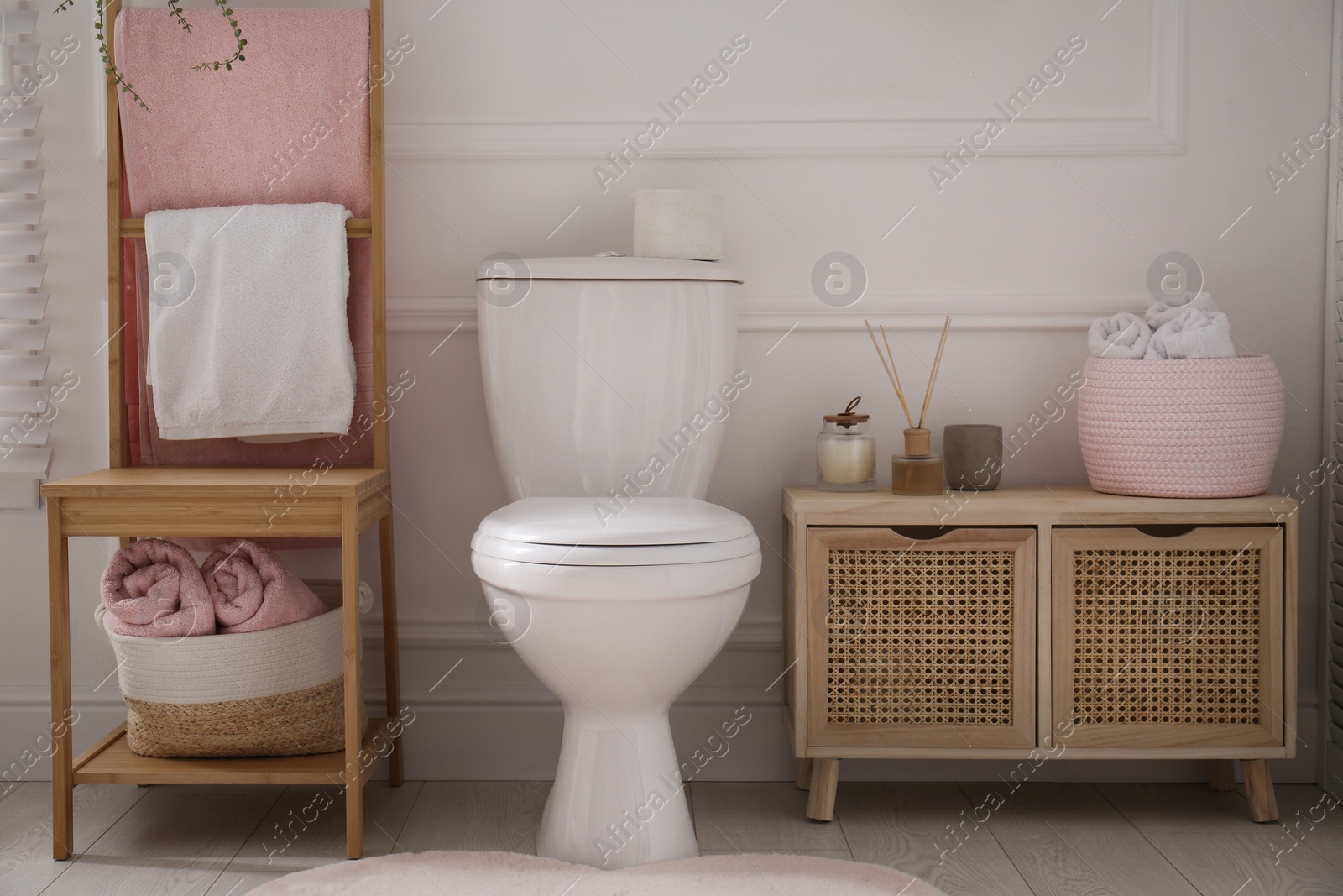 Photo of Stylish bathroom interior with toilet bowl and other essentials