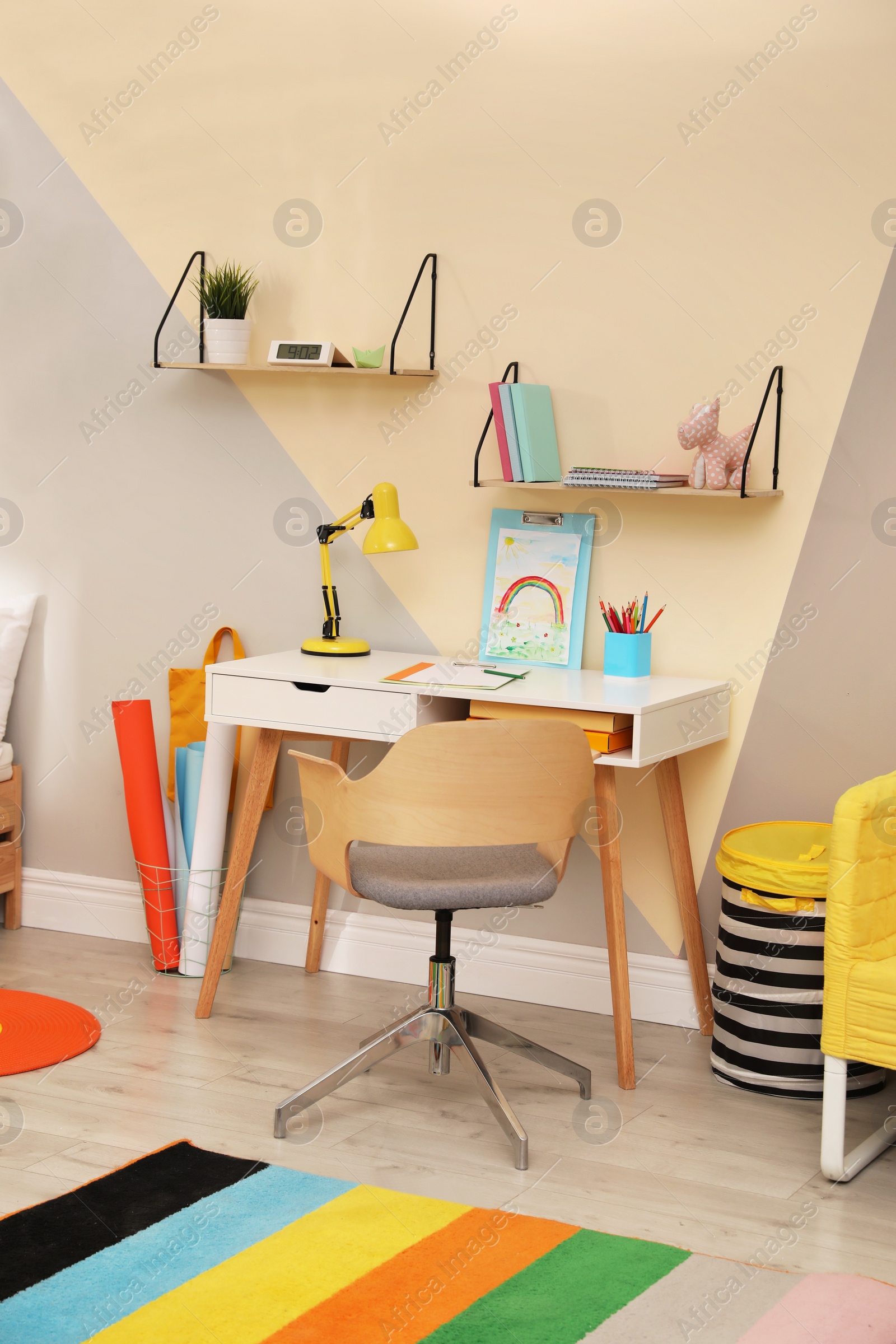 Photo of Stylish child room interior with modern furniture