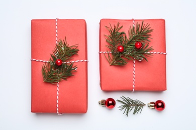 Photo of Flat lay composition with Christmas gifts on white background. Boxing day