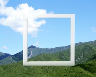 Image of Wooden frame and beautiful mountains under blue sky with cloud