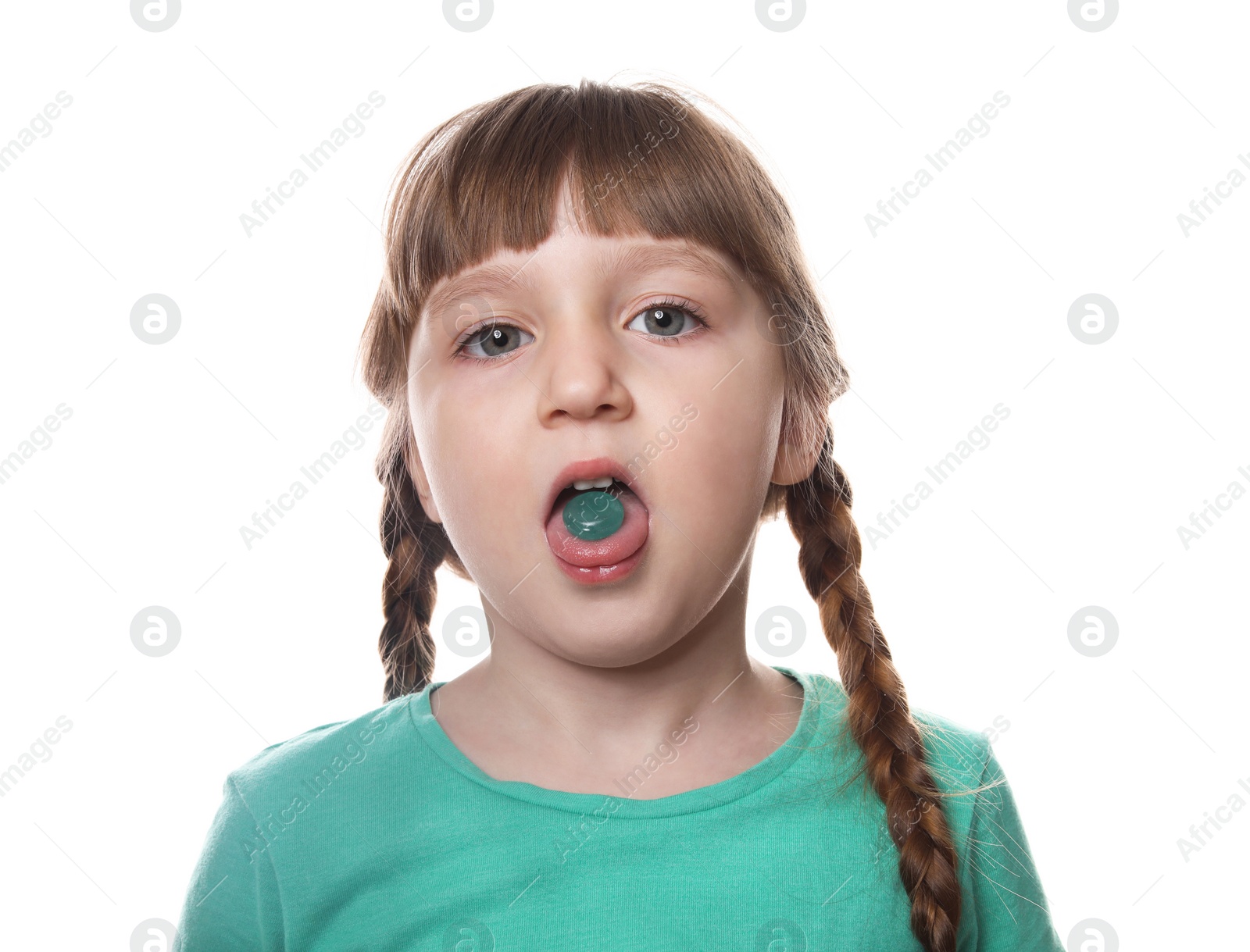 Photo of Little child taking pill on white background. Danger of medicament intoxication