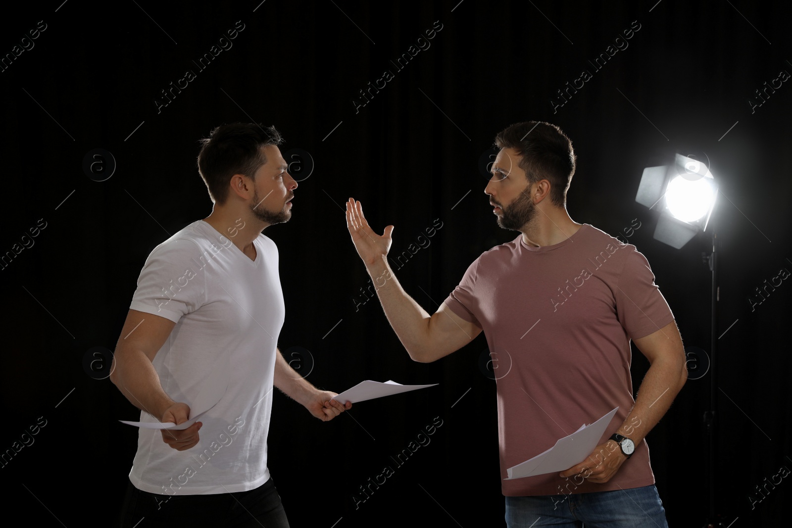 Photo of Professional actors rehearsing on stage in theatre