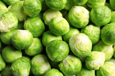 Photo of Pile of fresh Brussels sprouts as background, top view