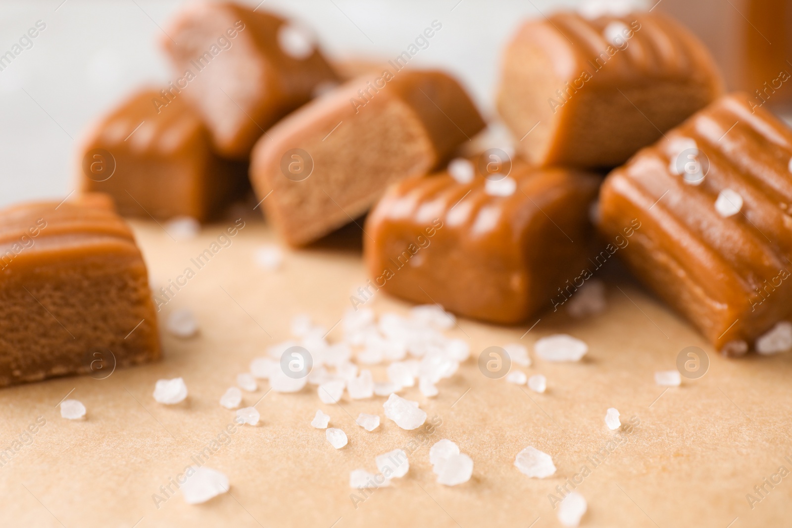 Photo of Salt and caramel on parchment, closeup view