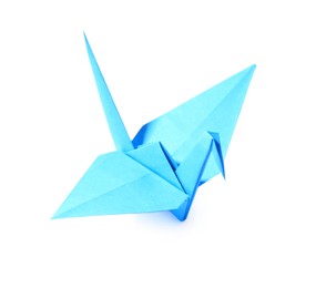 Photo of Origami art. Blue handmade paper crane isolated on white, above view