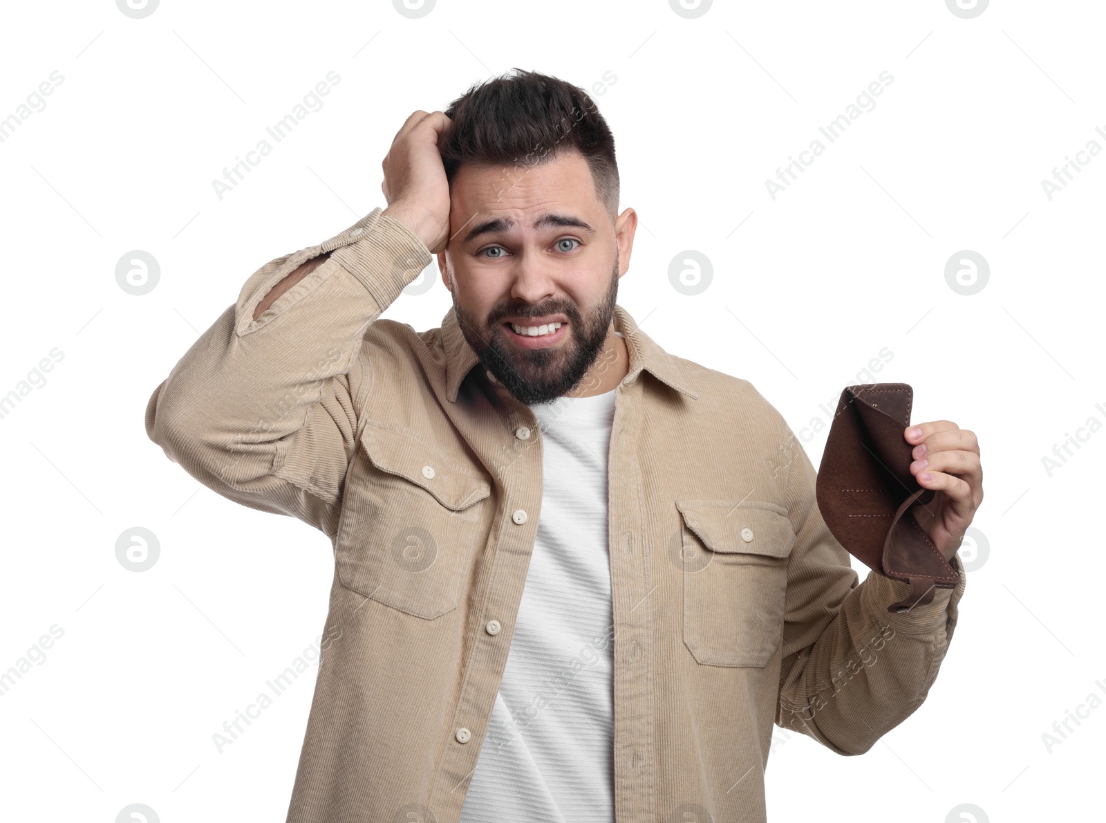 Photo of Confused man showing empty wallet on white background