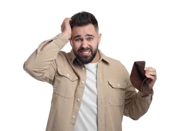 Photo of Confused man showing empty wallet on white background