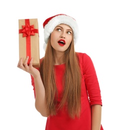 Photo of Young beautiful woman in Santa hat with gift box on white background. Christmas celebration