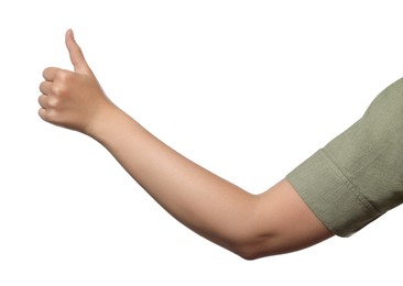Woman showing hitchhiking gesture on white background, closeup