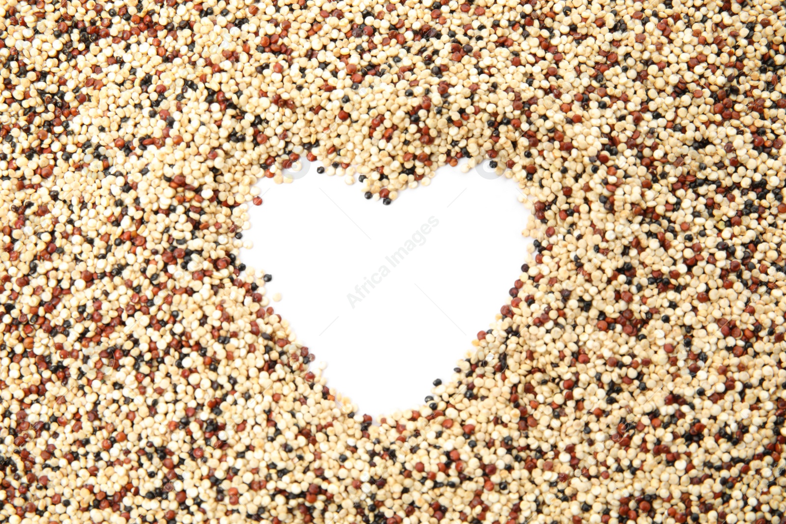 Photo of Heart shaped frame made of mixed quinoa seeds and space for text on white background, top view