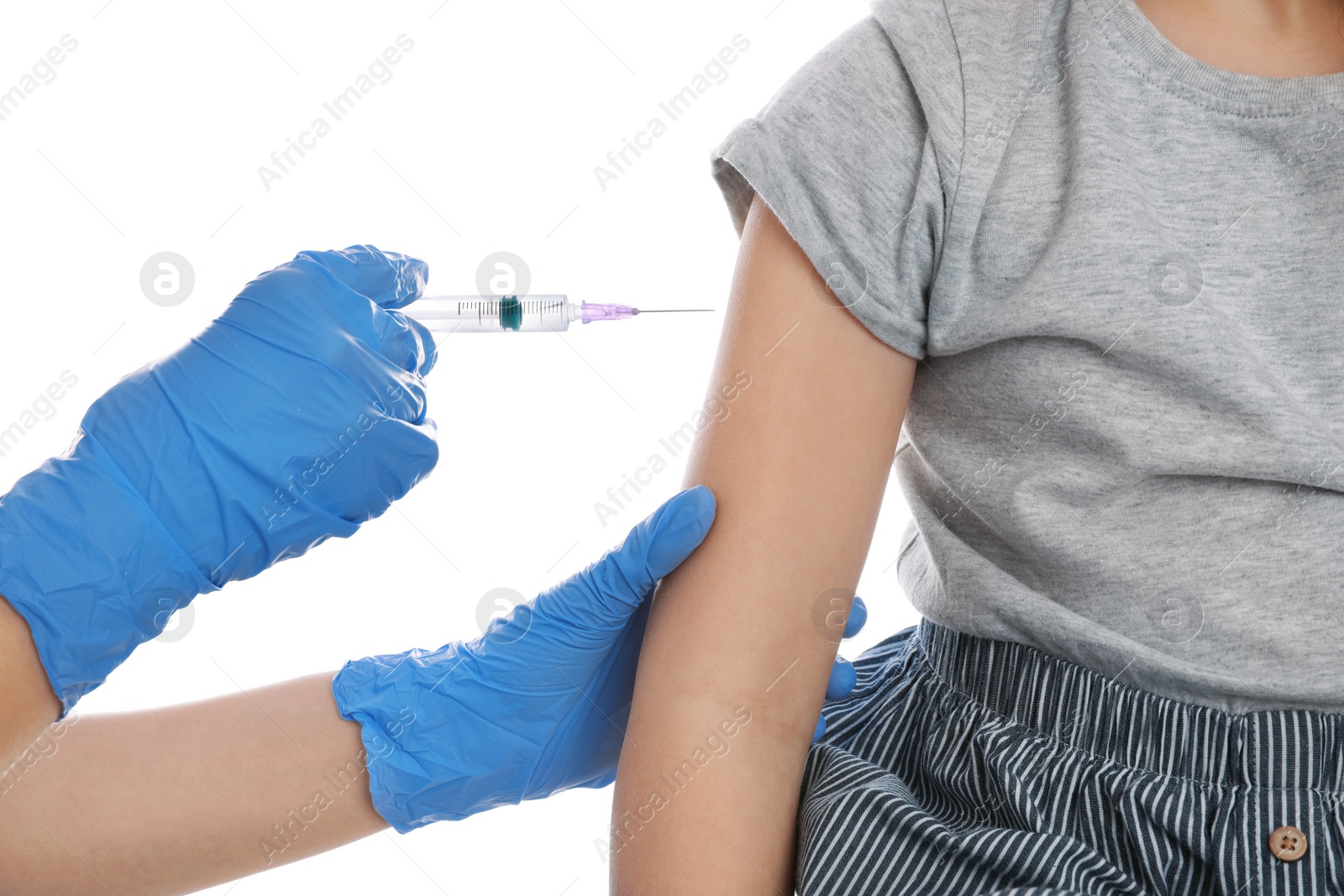 Photo of Little girl receiving chickenpox vaccination on white background, closeup. Varicella virus prevention