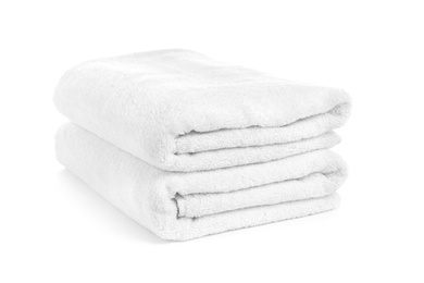 Folded clean soft towels on white background