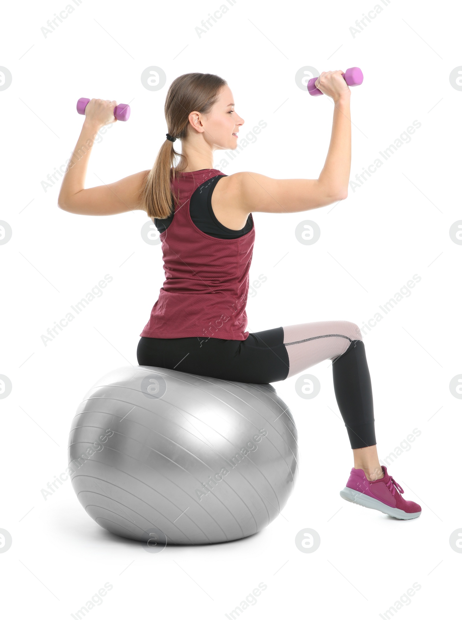 Photo of Young woman doing sports exercises isolated on white. Home fitness