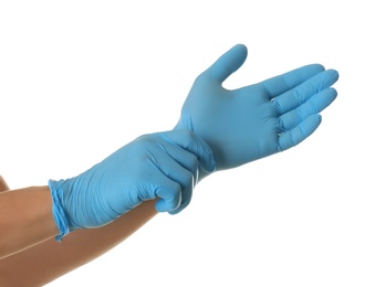 Photo of Person putting on blue latex gloves against white background, closeup