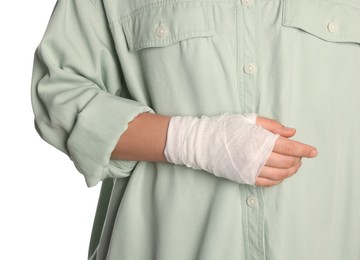 Photo of Woman with hand wrapped in medical bandage on white background, closeup