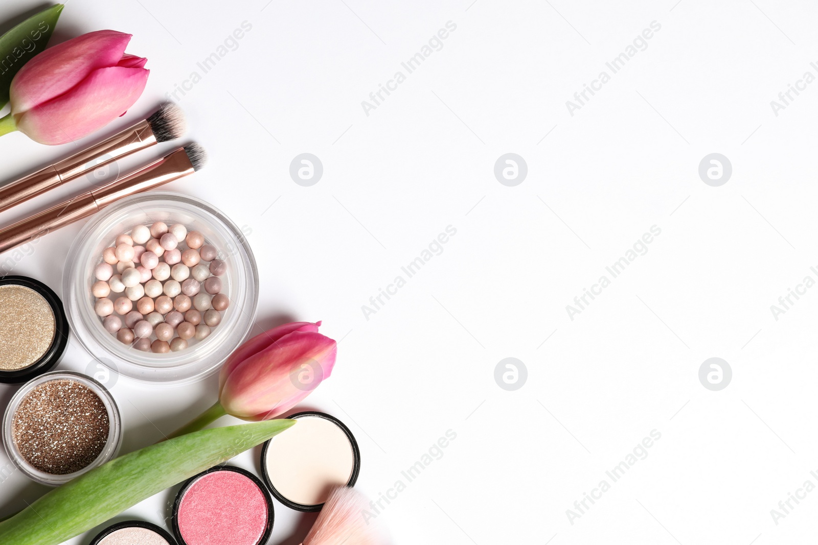 Photo of Different makeup products and flowers on white background, top view