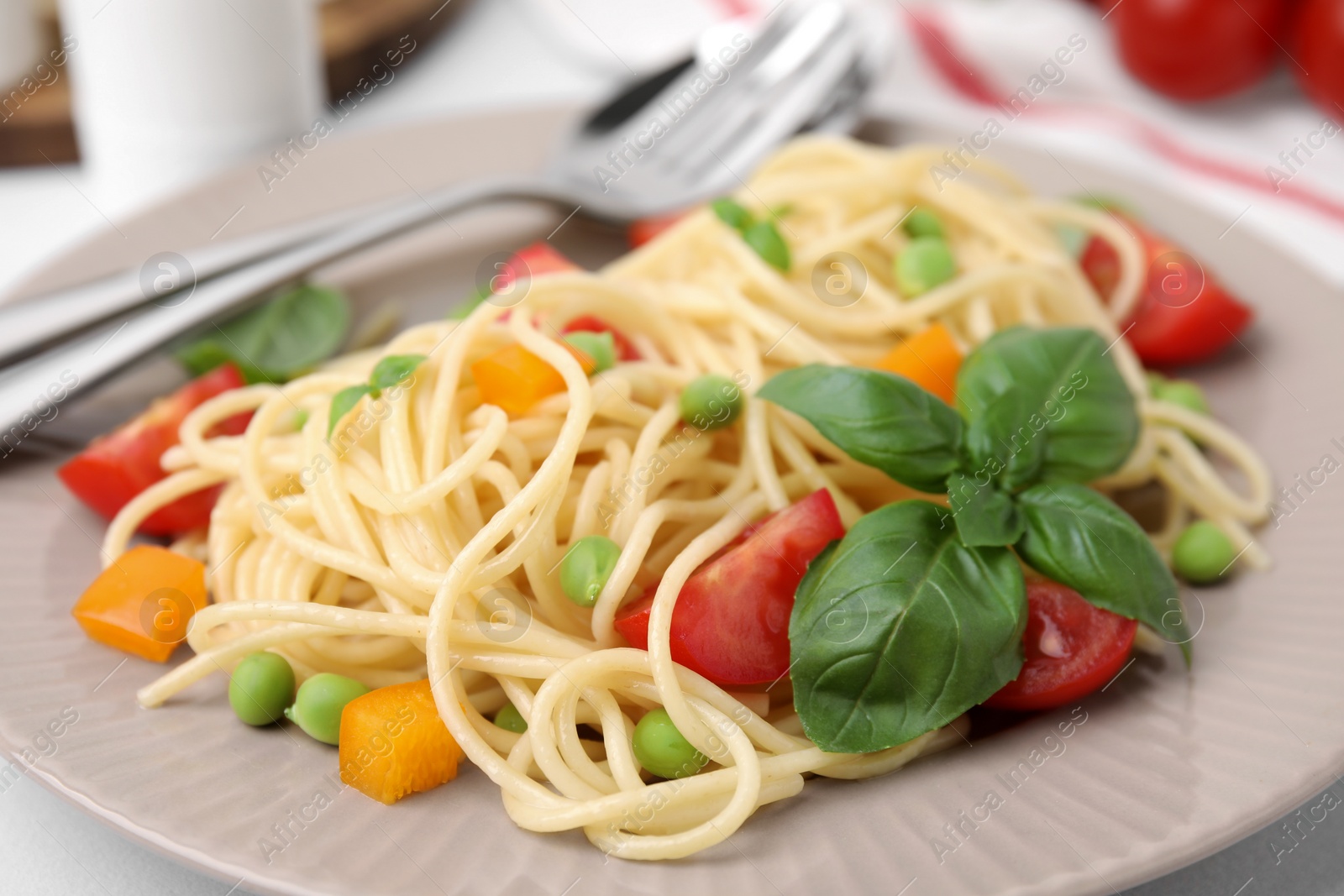 Photo of Plate of delicious pasta primavera, closeup view