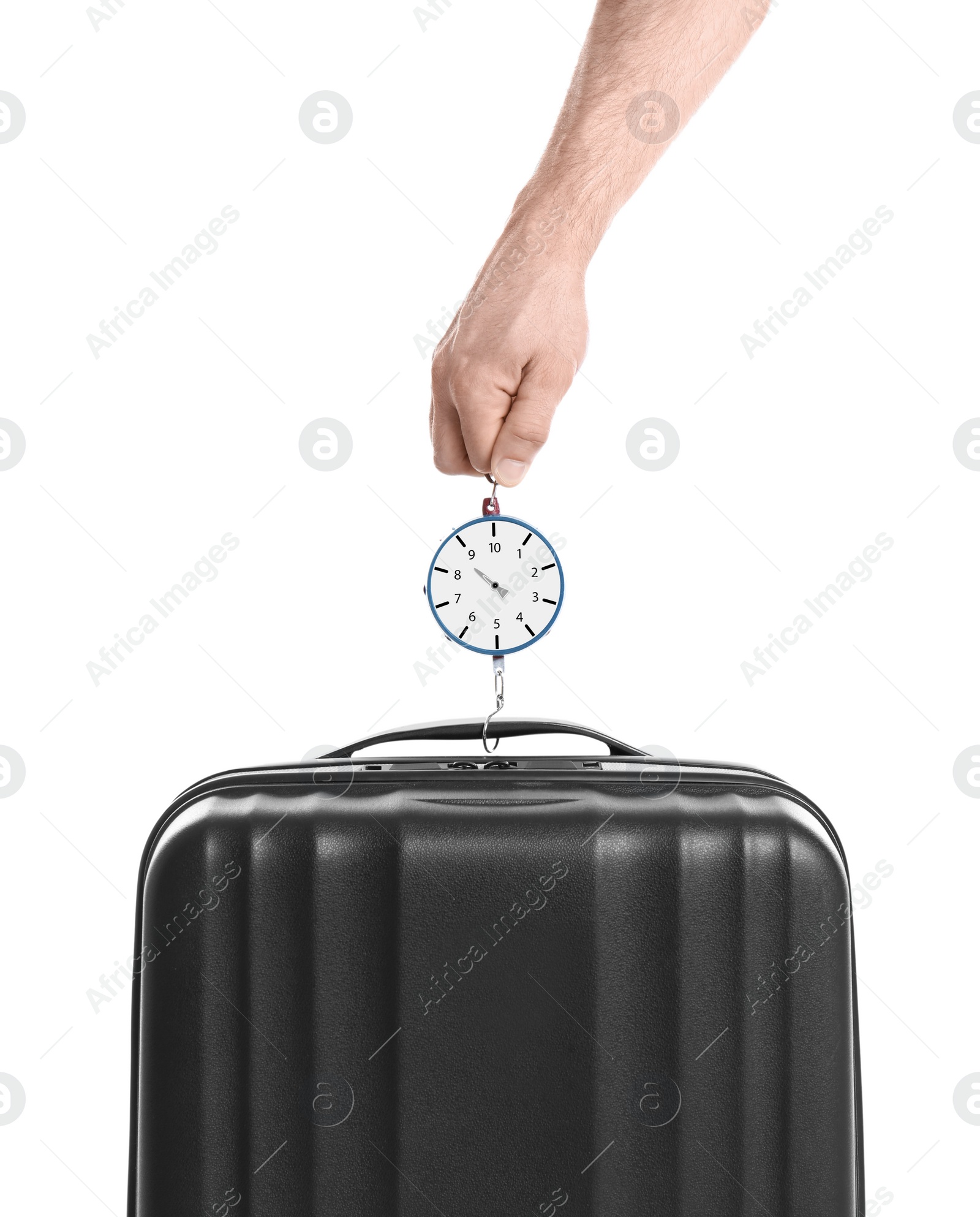 Photo of Man weighing stylish suitcase against white background, closeup