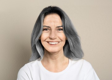 Image of Portrait of senior woman on light background