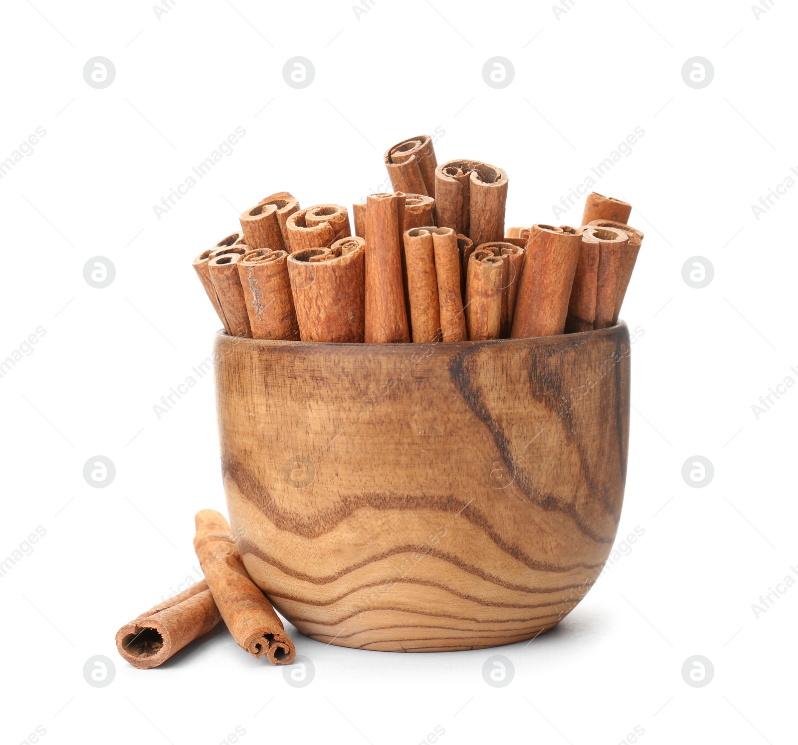 Photo of Bowl with aromatic cinnamon sticks on white background