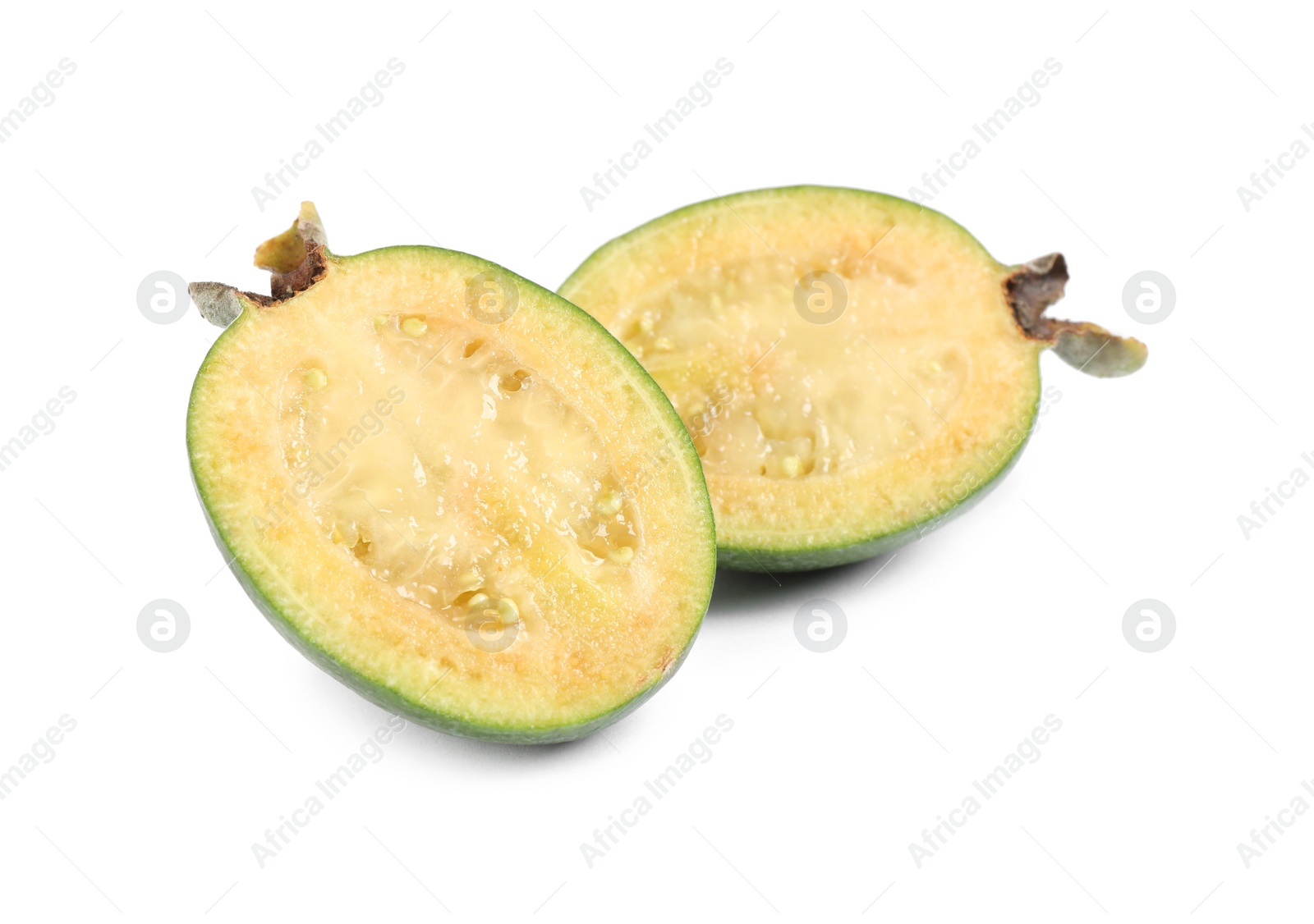 Photo of Halves of feijoa fruit on white background