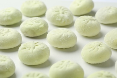 Photo of Raw dumplings on white background, closeup. Traditional dish
