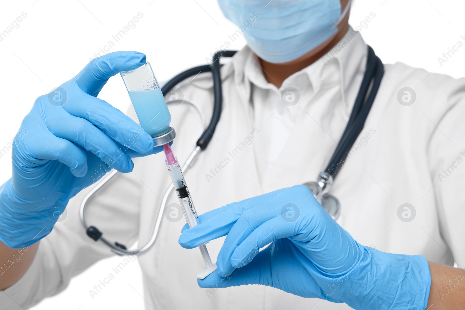 Photo of Doctor filling syringe with medication from glass vial on white background, closeup