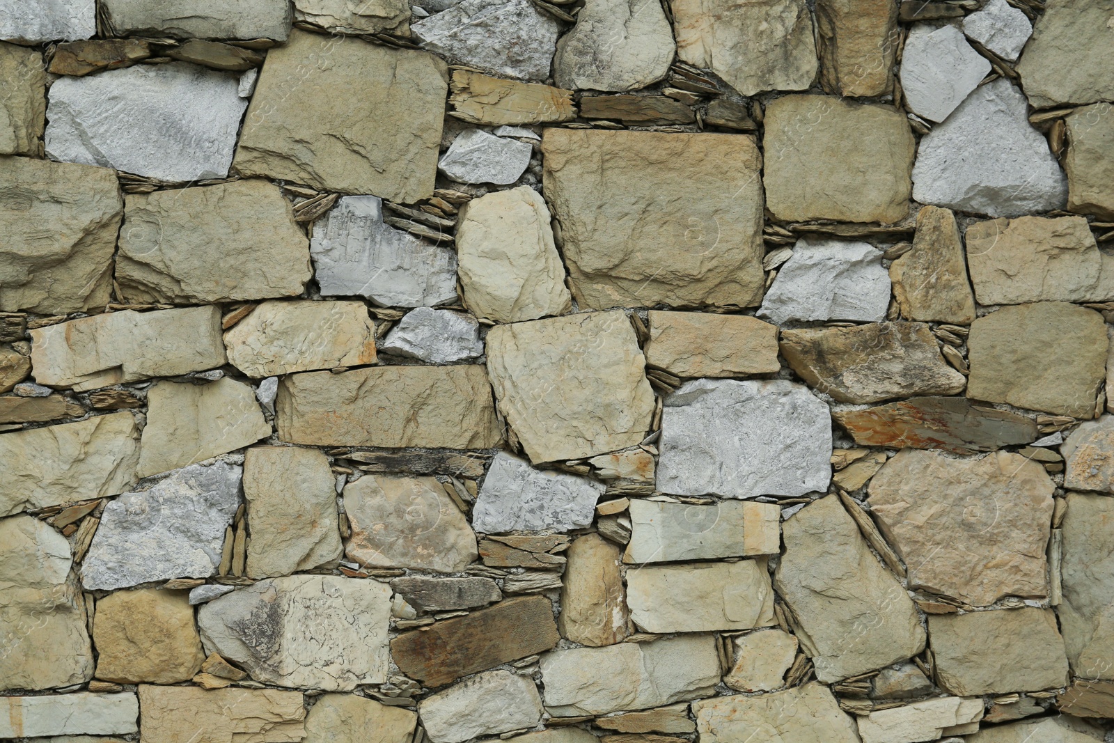 Photo of Texture of stone wall as background, closeup