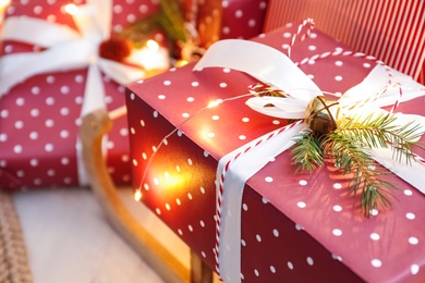 Photo of Beautiful Christmas gift on blurred background, closeup