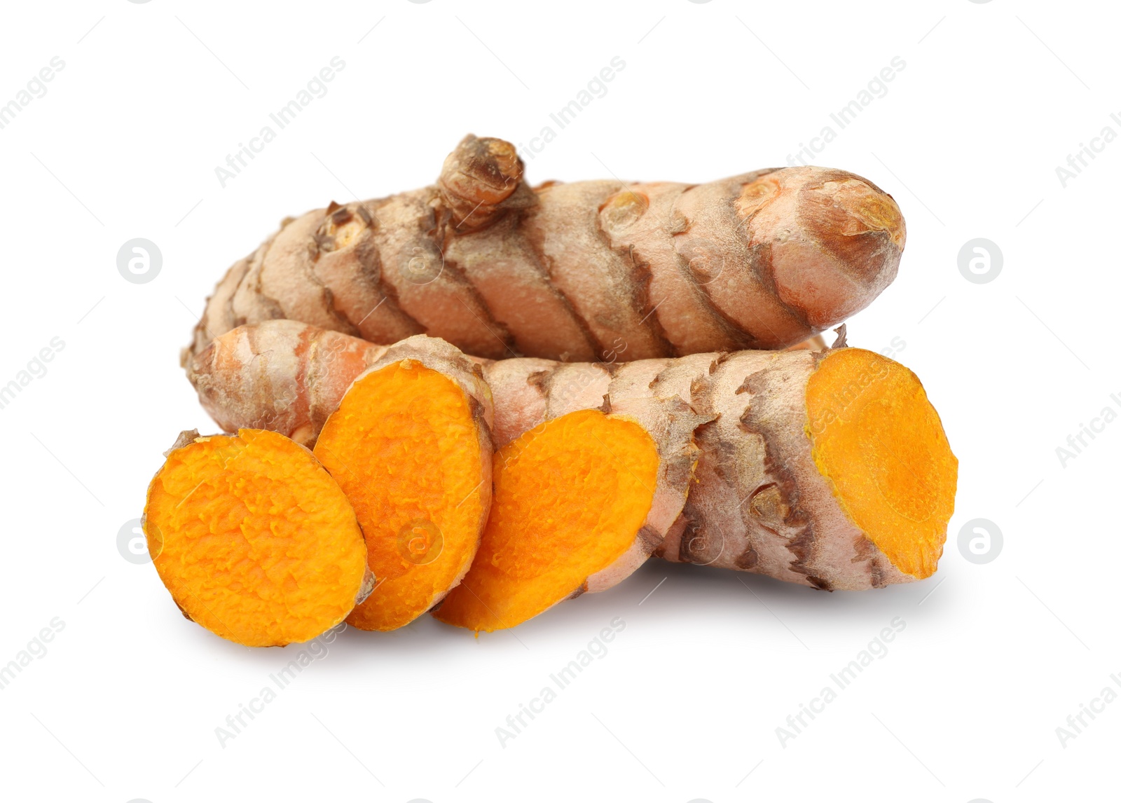 Photo of Whole and cut turmeric roots isolated on white