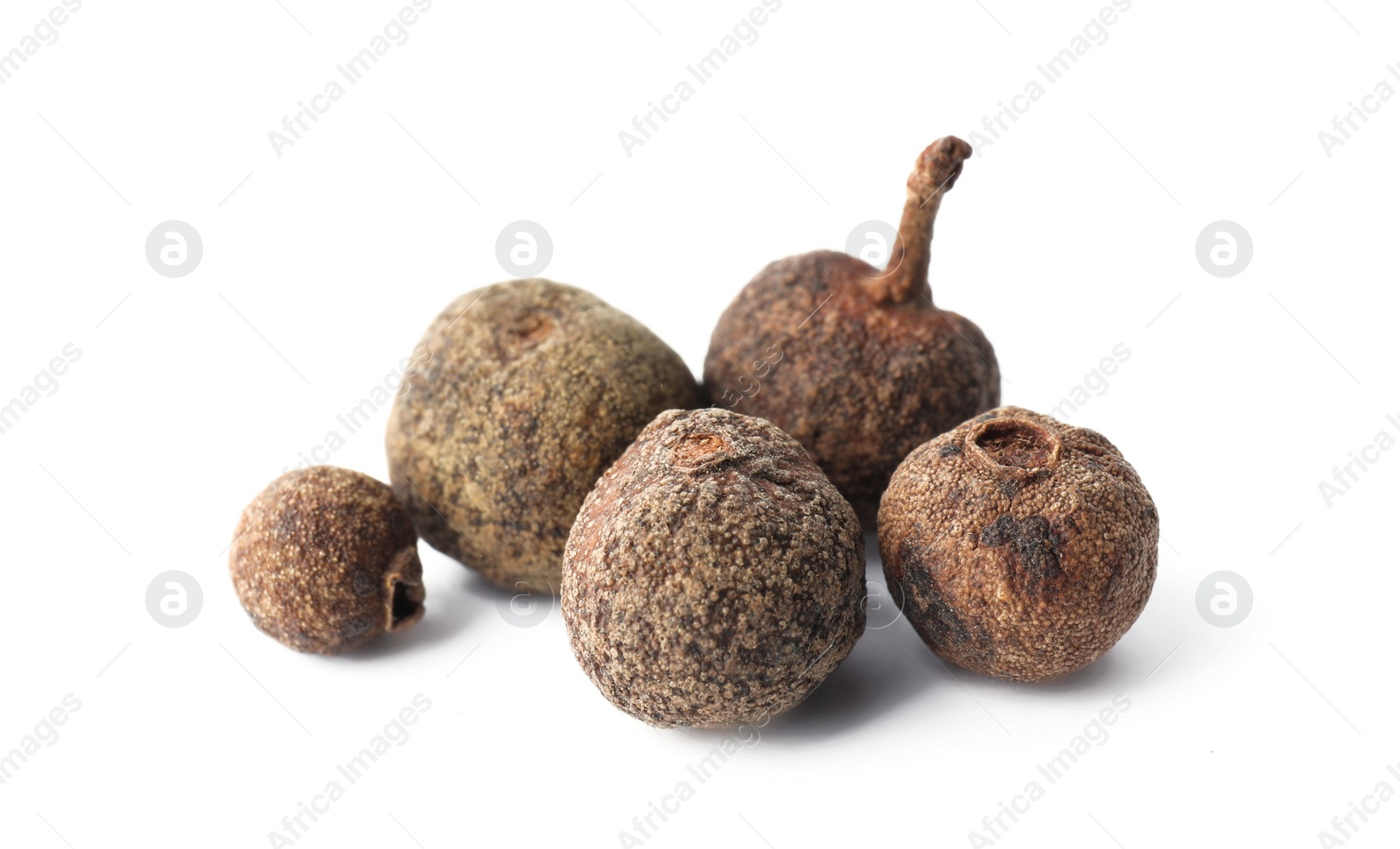 Photo of Spicy black pepper grains isolated on white