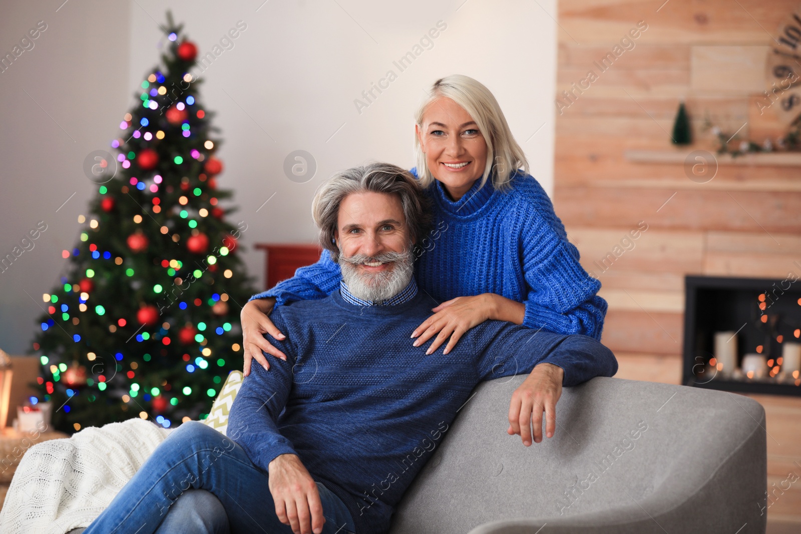 Photo of Happy mature couple celebrating Christmas at home