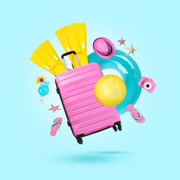 Image of Suitcase, cocktail and beach accessories flying on pale light blue background