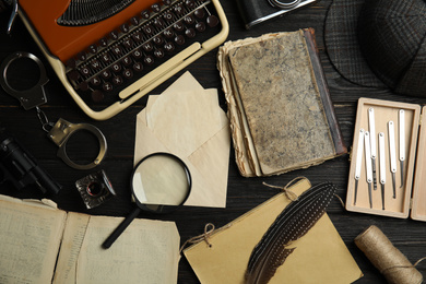 Photo of Composition with different vintage items on black wooden background. Detective's layout
