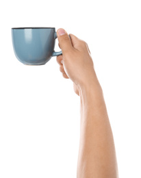 Woman holding blue cup on white background, closeup