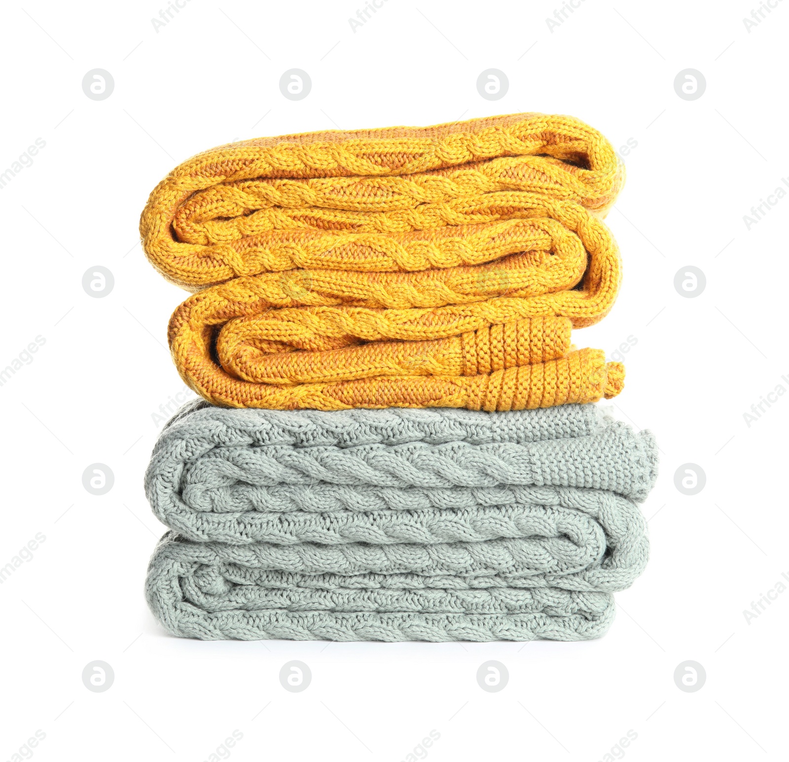 Photo of Different stylish knitted plaids on white background