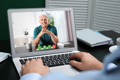 Image of Man using video chat for online job interview in office, closeup 