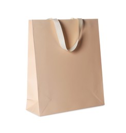Photo of One beige shopping bag isolated on white